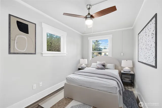 a bedroom with a large bed and a window