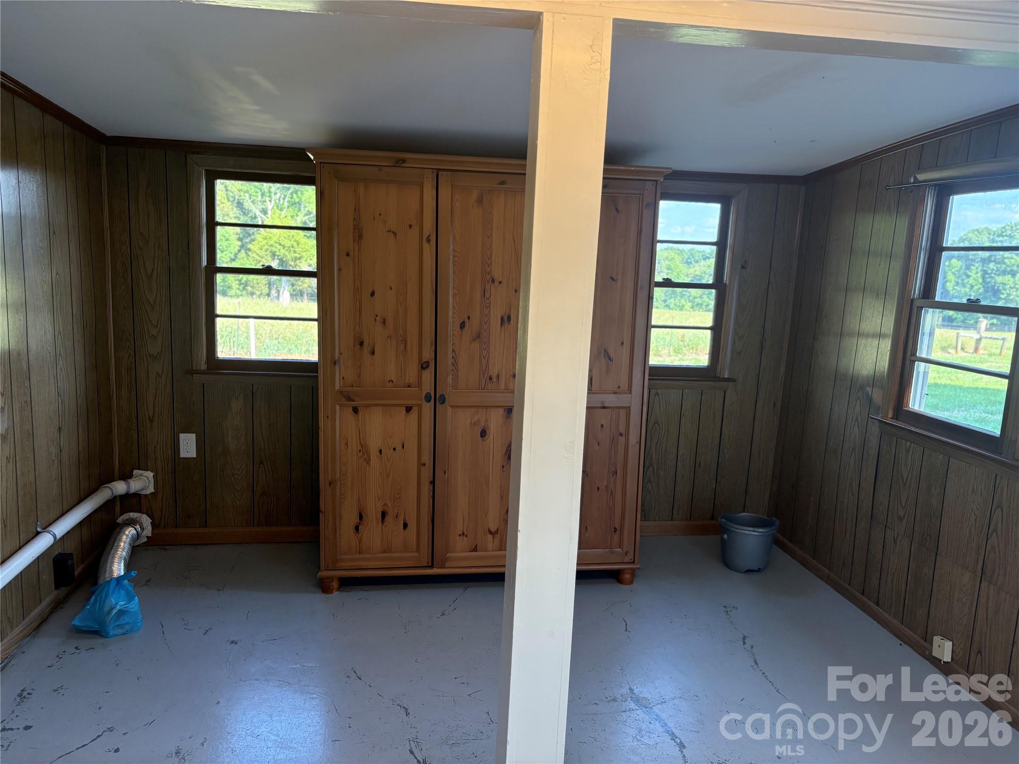 6625 Long Road Matthews, NC 28104 - Photo 10 of 21 a view of an empty room with windows and closet