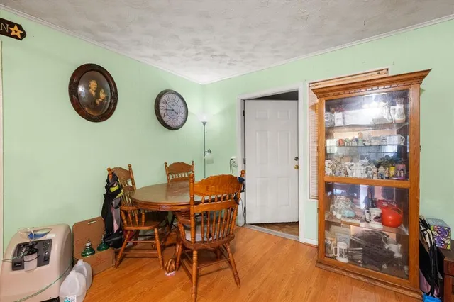 a view of a dining room with furniture and wall painting