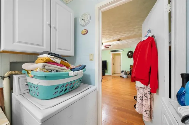 a living room with furniture and a bed