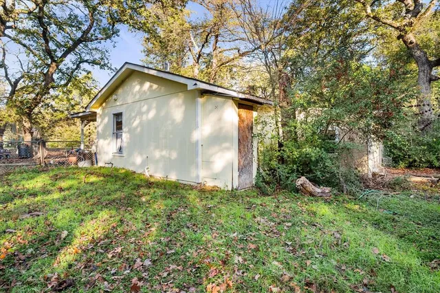 a backyard of a house with lots of green space