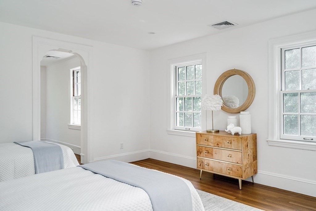 4 Welland Road Brookline, MA 02445 - Photo 11 of 15 a bedroom with a bed and a window