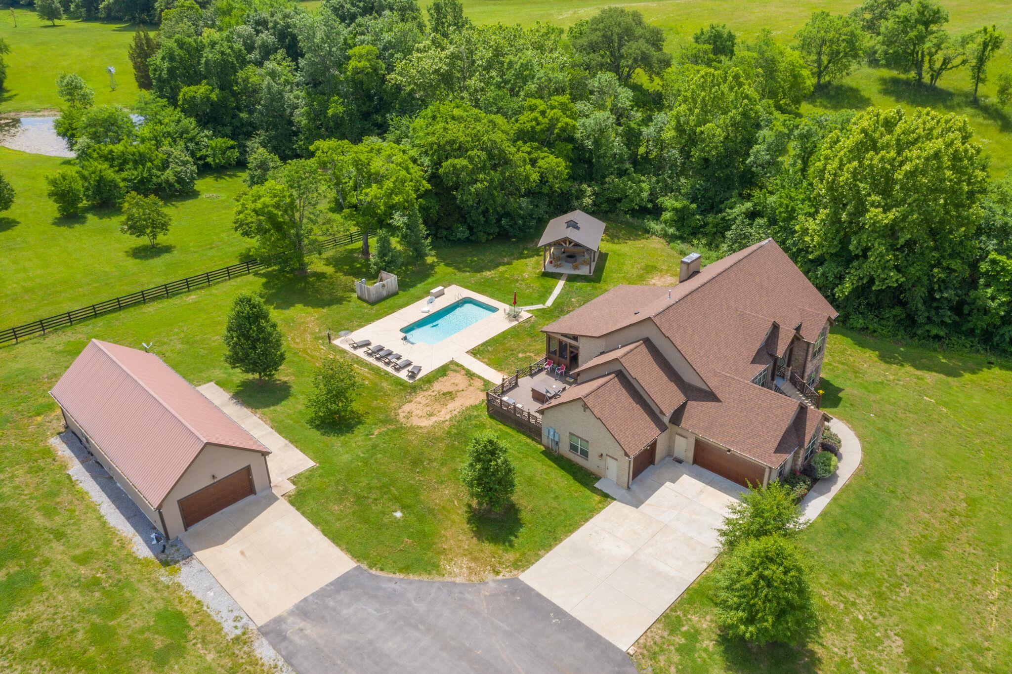 561 Cairo Bend Road Lebanon, TN 37087 - Photo 1 of 29 an aerial view of a house with a garden and swimming pool