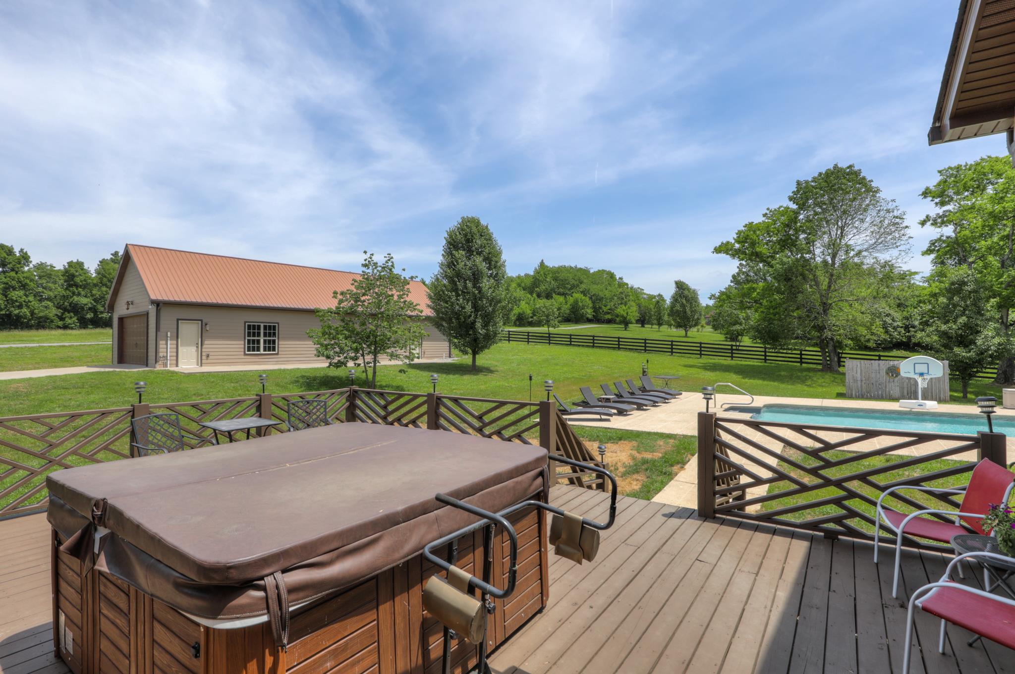 561 Cairo Bend Road Lebanon, TN 37087 - Photo 8 of 29 a view of a patio with table and chairs potted plants with wooden floor and fence