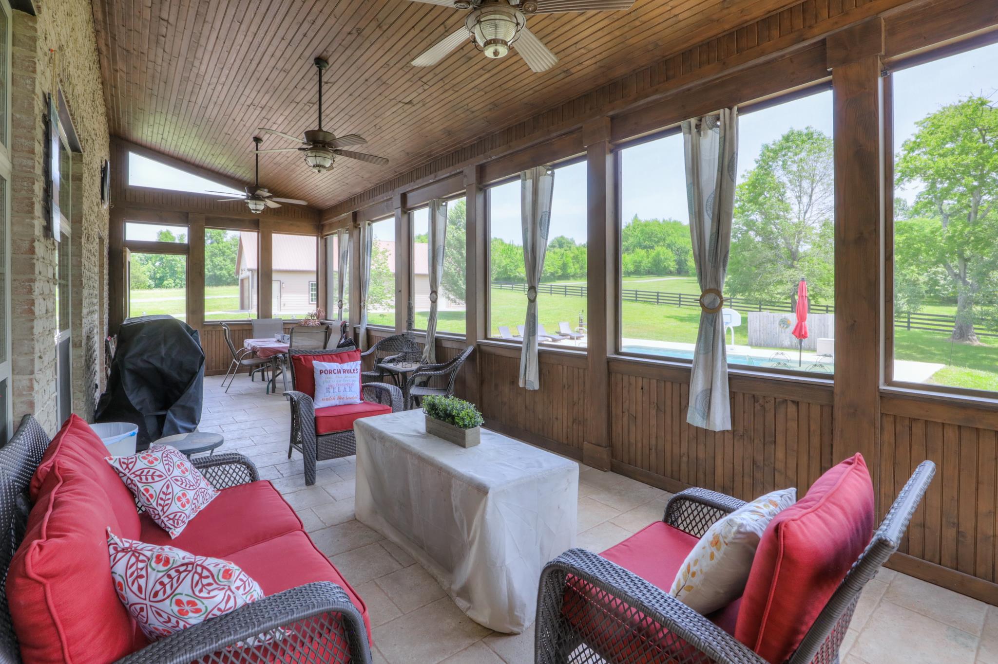 561 Cairo Bend Road Lebanon, TN 37087 - Photo 9 of 29 a living room with furniture and floor to ceiling windows