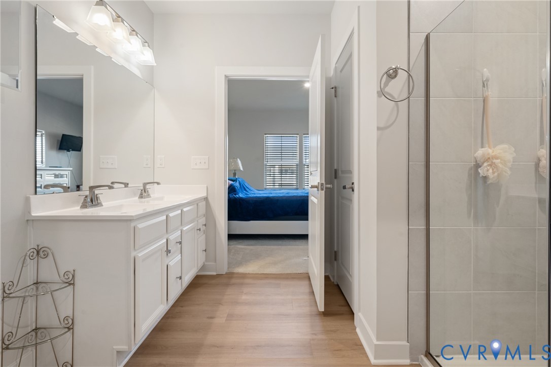 6601 Citory Way, Unit 304 Moseley, VA 23120 - Photo 16 of 33 a bathroom with double vanity sinks and a mirror