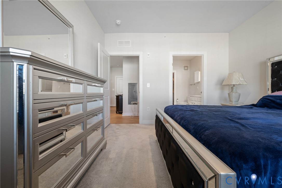 6601 Citory Way, Unit 304 Moseley, VA 23120 - Photo 22 of 33 a bedroom with a bed and a large window