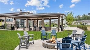 6601 Citory Way, Unit 304 Moseley, VA 23120 - Photo 27 of 33 a view of an chairs and table in patio with a yard