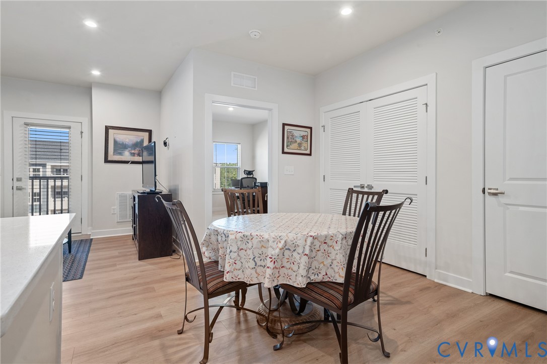 6601 Citory Way, Unit 304 Moseley, VA 23120 - Photo 6 of 33 a view of a dining room with furniture and wooden floor