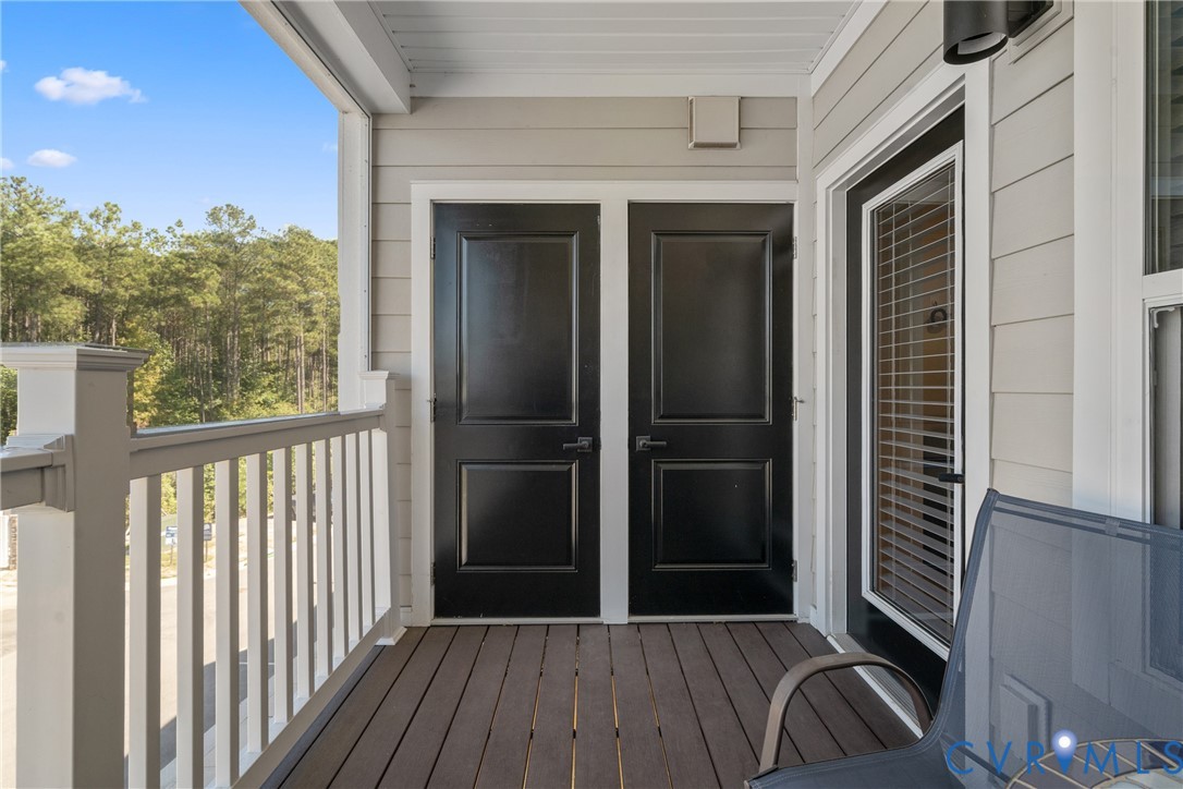 6601 Citory Way, Unit 304 Moseley, VA 23120 - Photo 9 of 33 a view of a porch with wooden floor and outdoor space