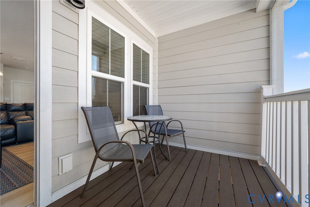 6601 Citory Way, Unit 304 Moseley, VA 23120 - Photo 10 of 33 a view of a chair and table in the balcony