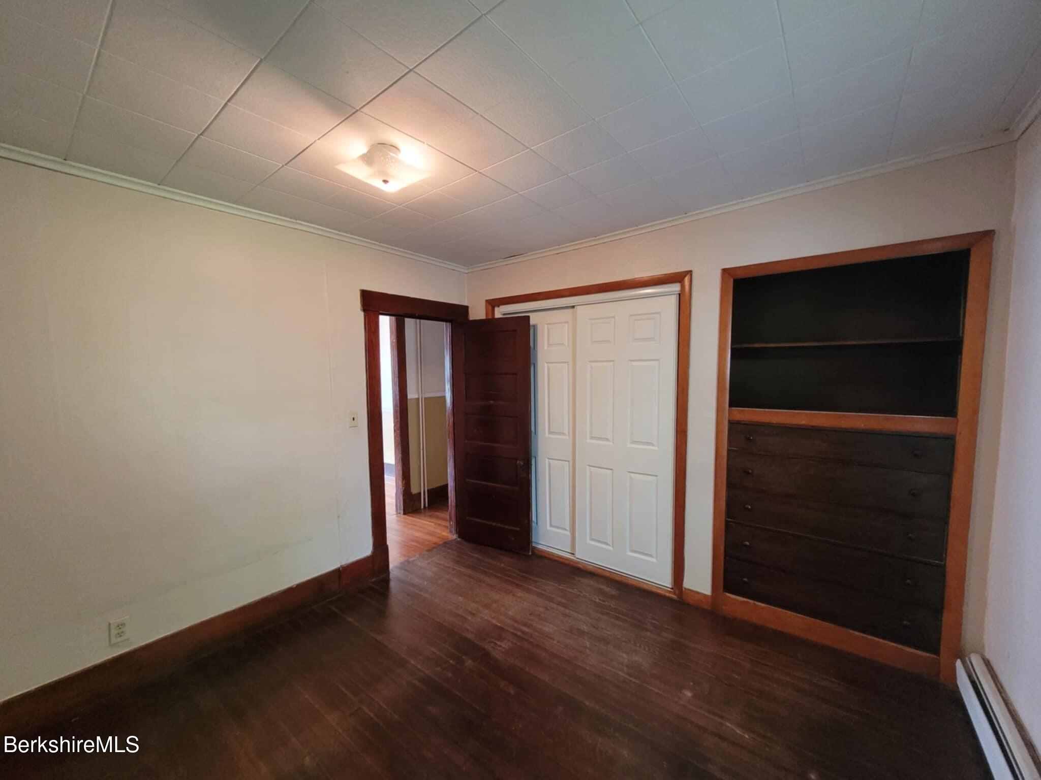 14 Pine Street Adams, MA 01220 - Photo 6 of 8 an empty room with closet area