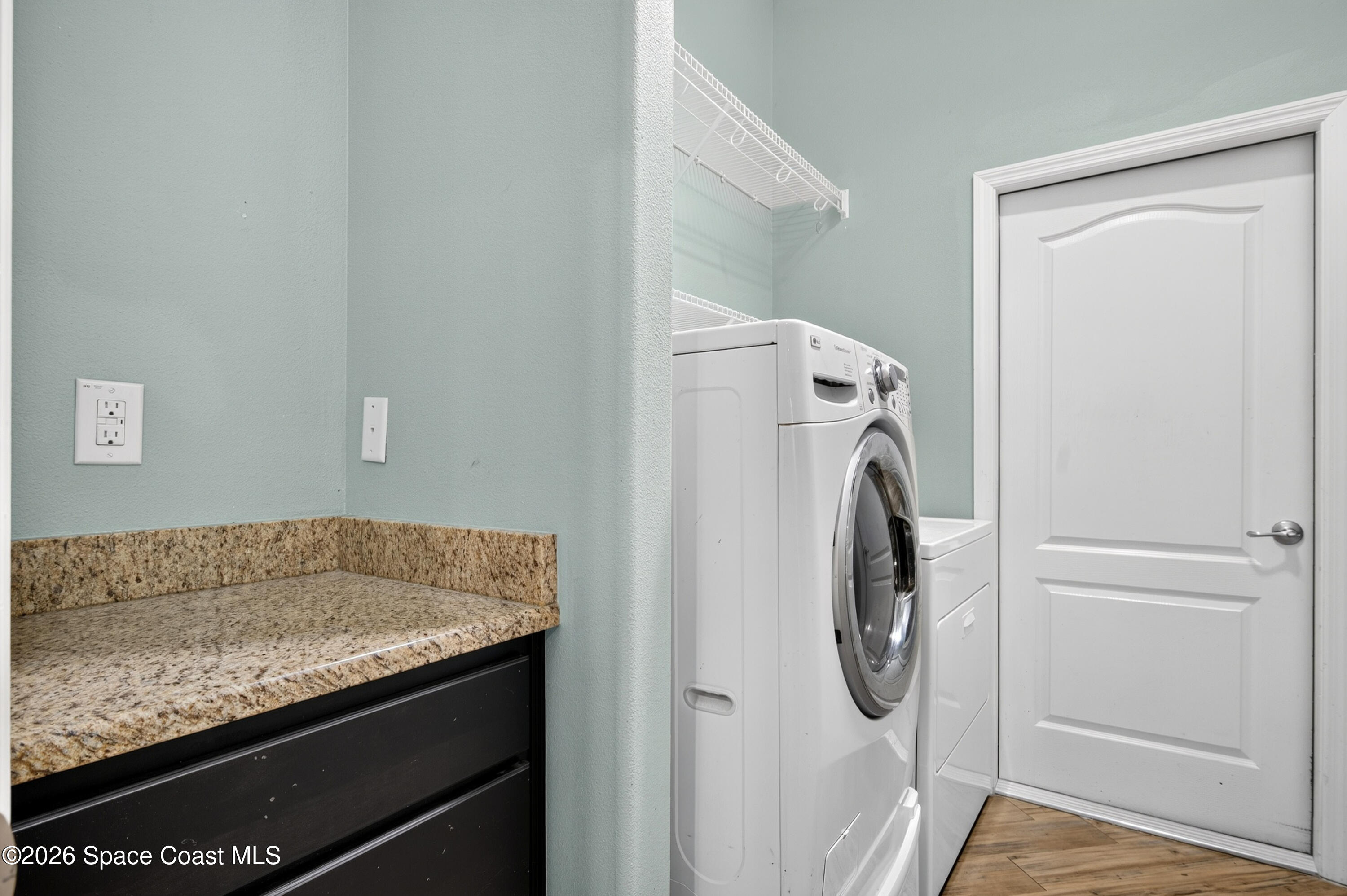 1475 Dalbora Road Merritt Island, FL 32953 - Photo 31 of 57 a utility room with washer and dryer