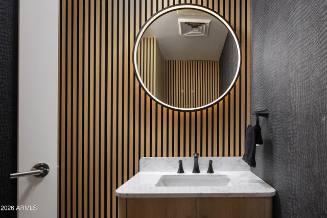 a living room with furniture flat screen tv and a floor to ceiling window