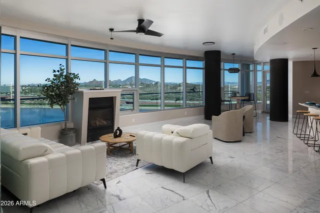 a kitchen with stainless steel appliances kitchen island granite countertop a stove a sink and a refrigerator