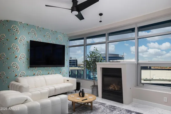a living room with furniture and a fireplace