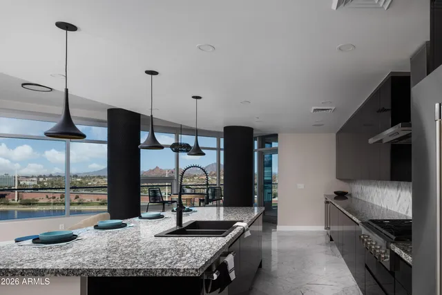 a front view of a residential apartment building with a yard