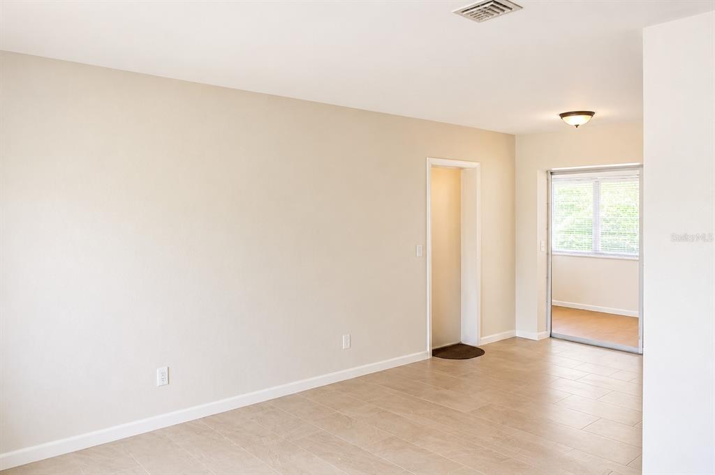 1559 Barry Road Clearwater, FL 33756 - Photo 9 of 20 an empty room with windows