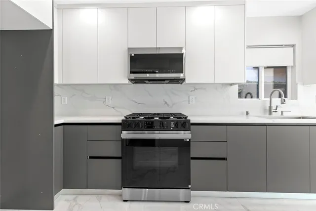 a view of a hallway with washer and dryer