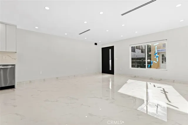 a view of empty room with windows