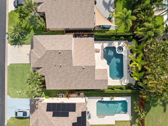 an aerial view of a house with a garden