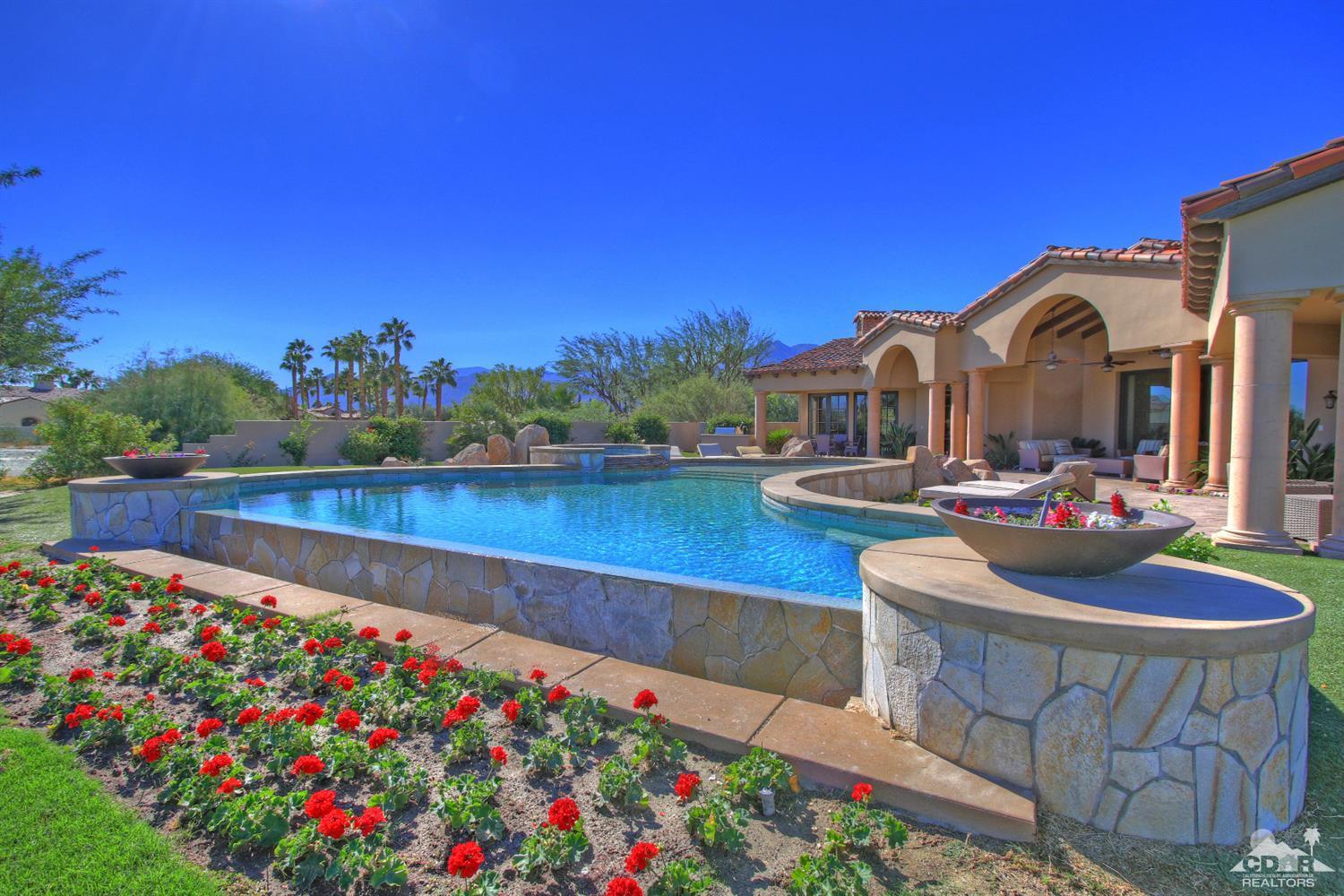 57300 Peninsula Lane La Quinta, CA 92253 - Photo 2 of 97 a view of swimming pool with outdoor seating and city view