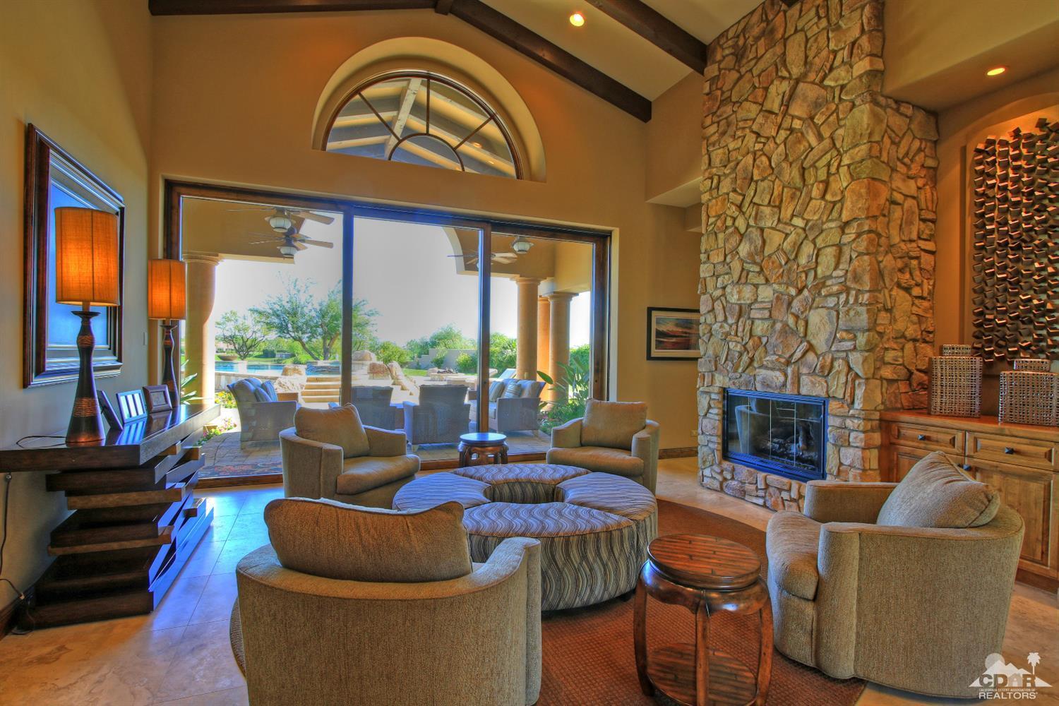 57300 Peninsula Lane La Quinta, CA 92253 - Photo 13 of 97 a living room with fireplace furniture and a large window
