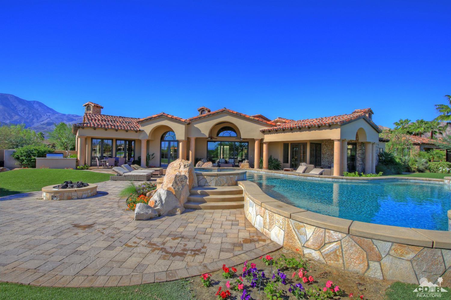 57300 Peninsula Lane La Quinta, CA 92253 - Photo 3 of 97 a front view of house with yard and green space
