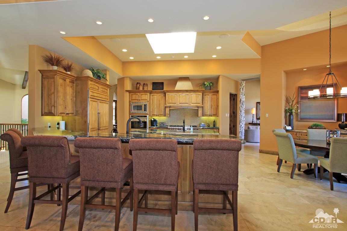 57300 Peninsula Lane La Quinta, CA 92253 - Photo 24 of 97 a dining hall with stainless steel appliances a dining table and chairs