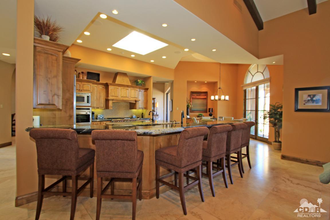 57300 Peninsula Lane La Quinta, CA 92253 - Photo 25 of 97 a dining hall with stainless steel appliances a dining table and chairs