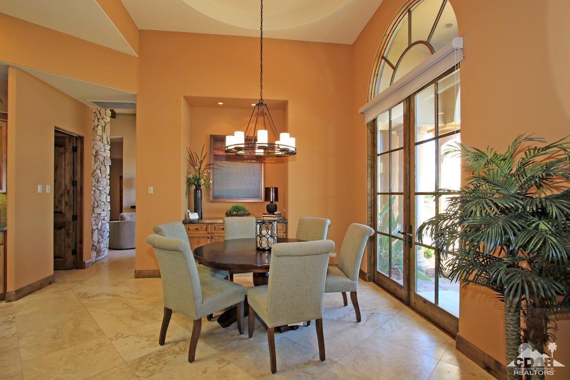 57300 Peninsula Lane La Quinta, CA 92253 - Photo 33 of 97 a view of a dining room with furniture a chandelier and wooden floor