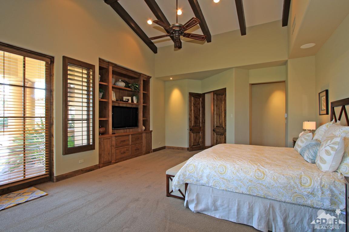 57300 Peninsula Lane La Quinta, CA 92253 - Photo 38 of 97 a bedroom with a large bed and a large window