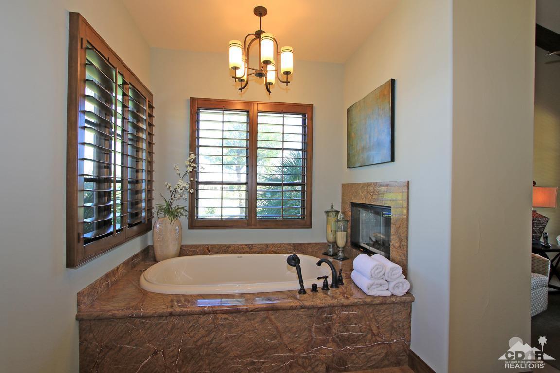 57300 Peninsula Lane La Quinta, CA 92253 - Photo 41 of 97 a bath tub sitting in a room next to a fireplace