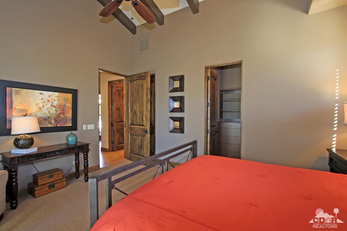 57300 Peninsula Lane La Quinta, CA 92253 - Photo 48 of 97 a bed room with a bed and a flat tv screen