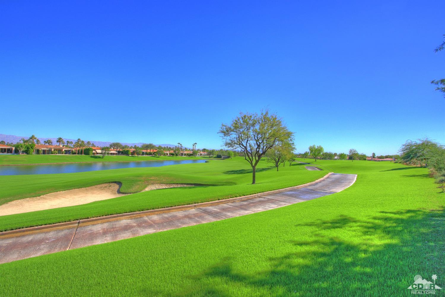 57300 Peninsula Lane La Quinta, CA 92253 - Photo 6 of 97 a view of a golf course with a lake