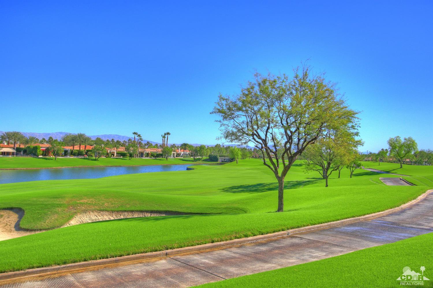 57300 Peninsula Lane La Quinta, CA 92253 - Photo 74 of 97 a view of a golf course with a lake