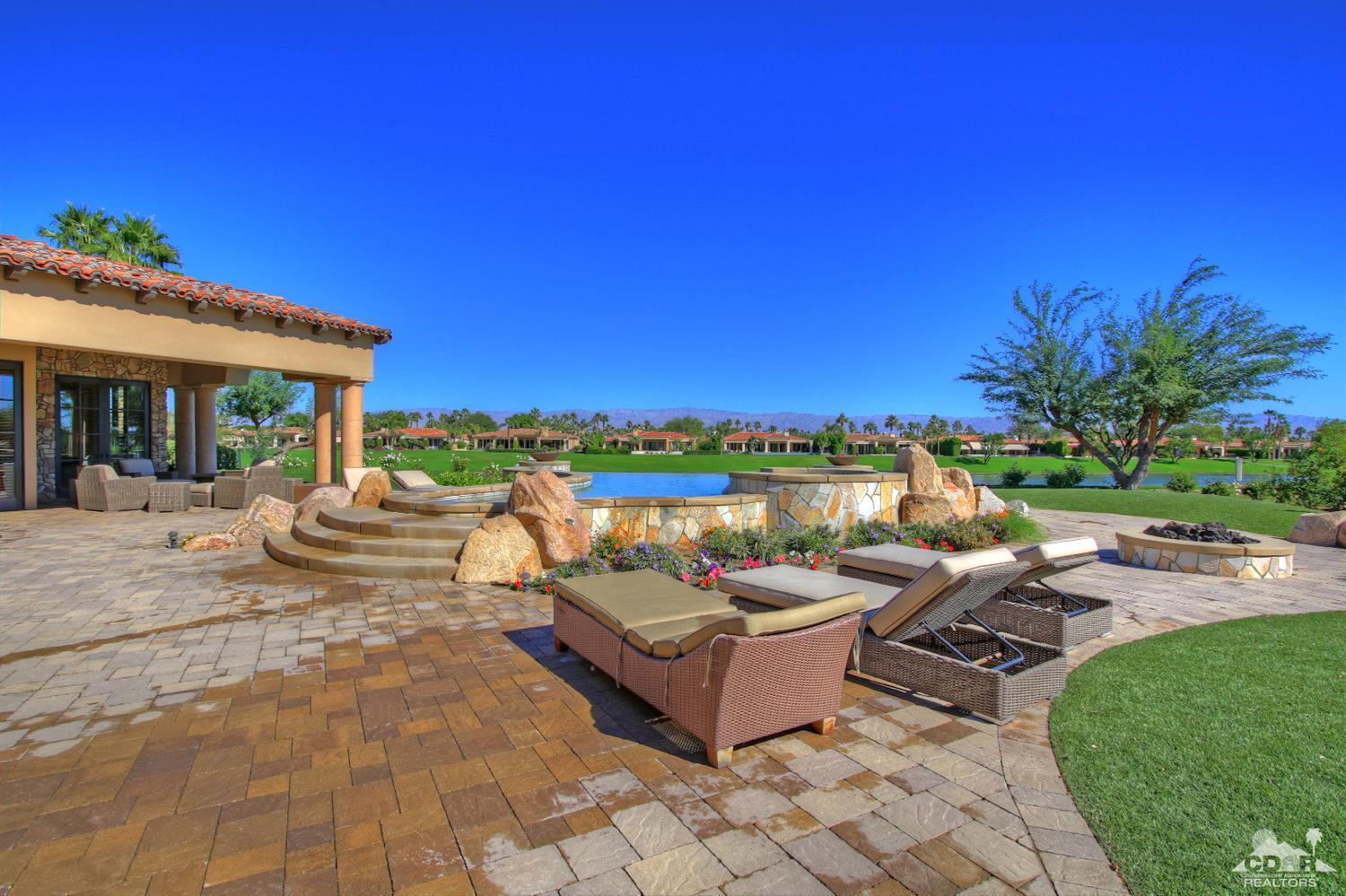 57300 Peninsula Lane La Quinta, CA 92253 - Photo 75 of 97 a view of a patio with couches and table and chairs and potted plants