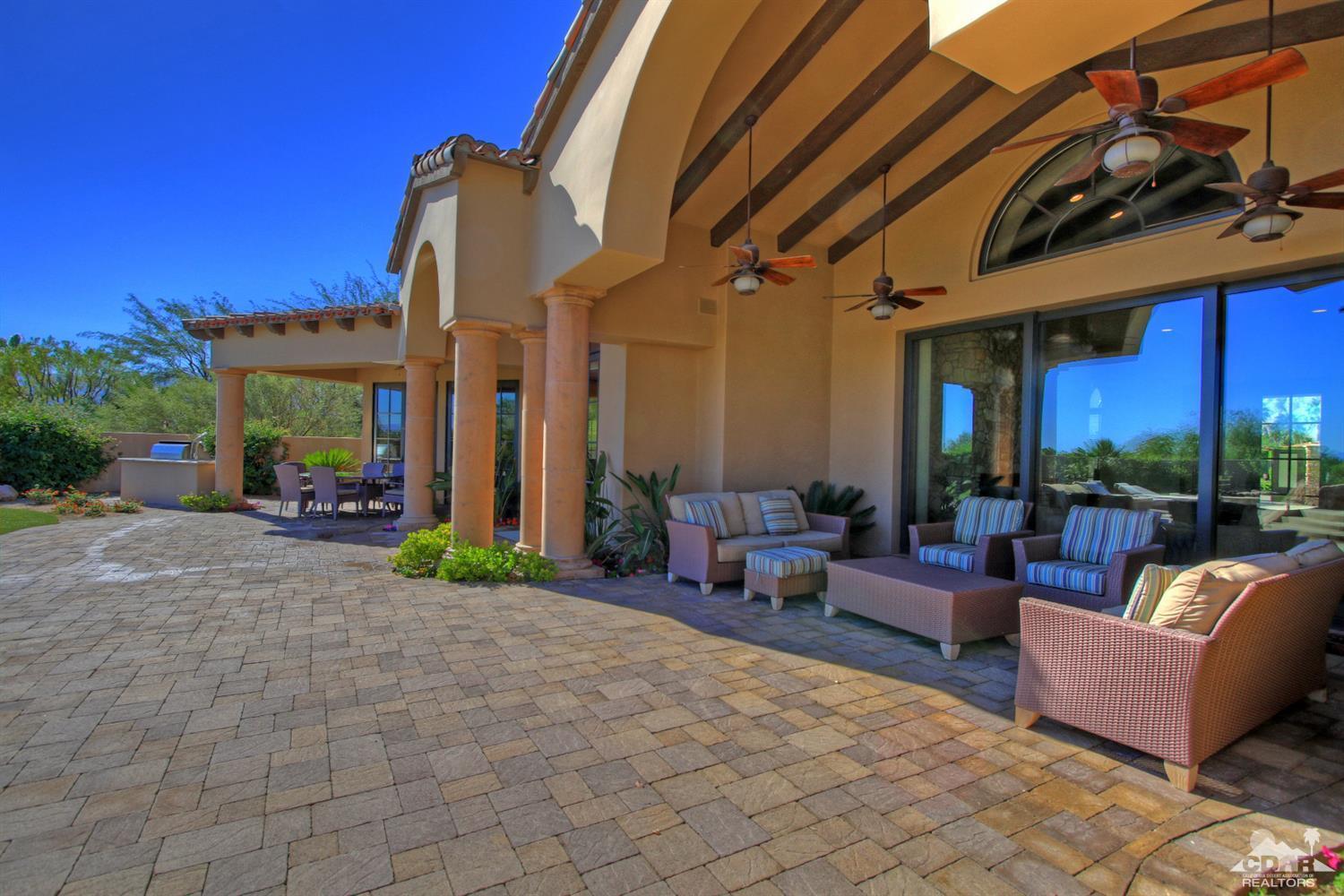 57300 Peninsula Lane La Quinta, CA 92253 - Photo 80 of 97 a view of a patio with couches and table and chairs and potted plants