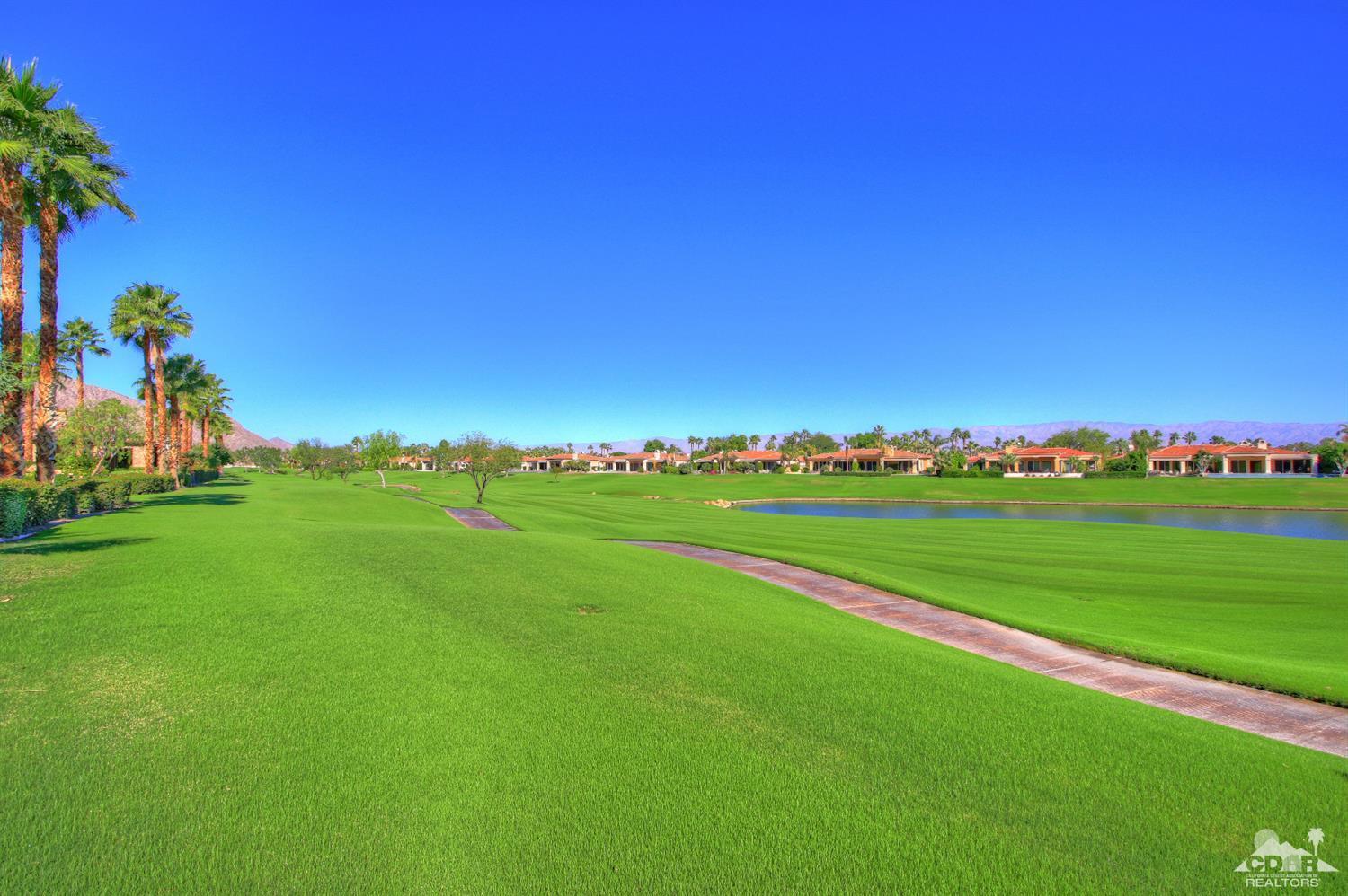 57300 Peninsula Lane La Quinta, CA 92253 - Photo 81 of 97 a view of a golf course with a lake