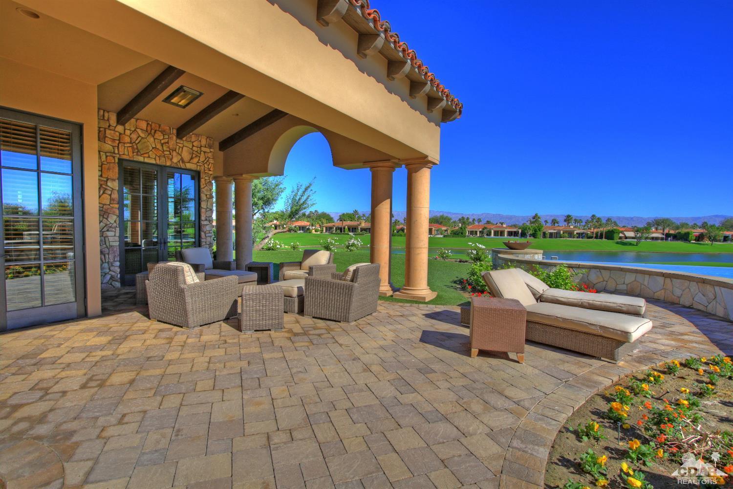 57300 Peninsula Lane La Quinta, CA 92253 - Photo 82 of 97 a view of a patio with couches chairs and potted plants