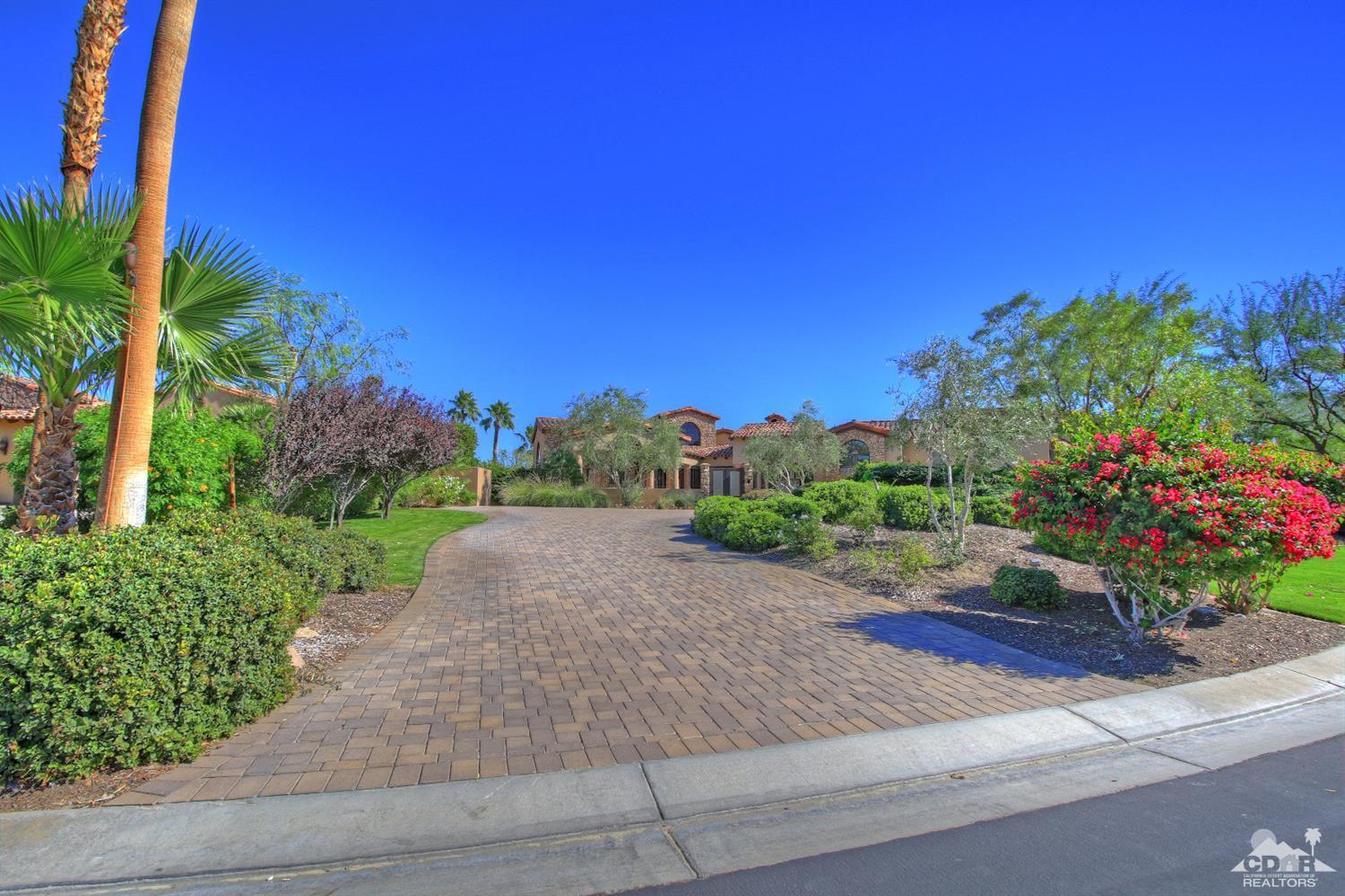 57300 Peninsula Lane La Quinta, CA 92253 - Photo 90 of 97 a view of a garden with a building in the background