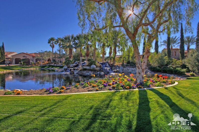 57300 Peninsula Lane La Quinta, CA 92253 - Photo 92 of 97 a view of a lake with a building in the background