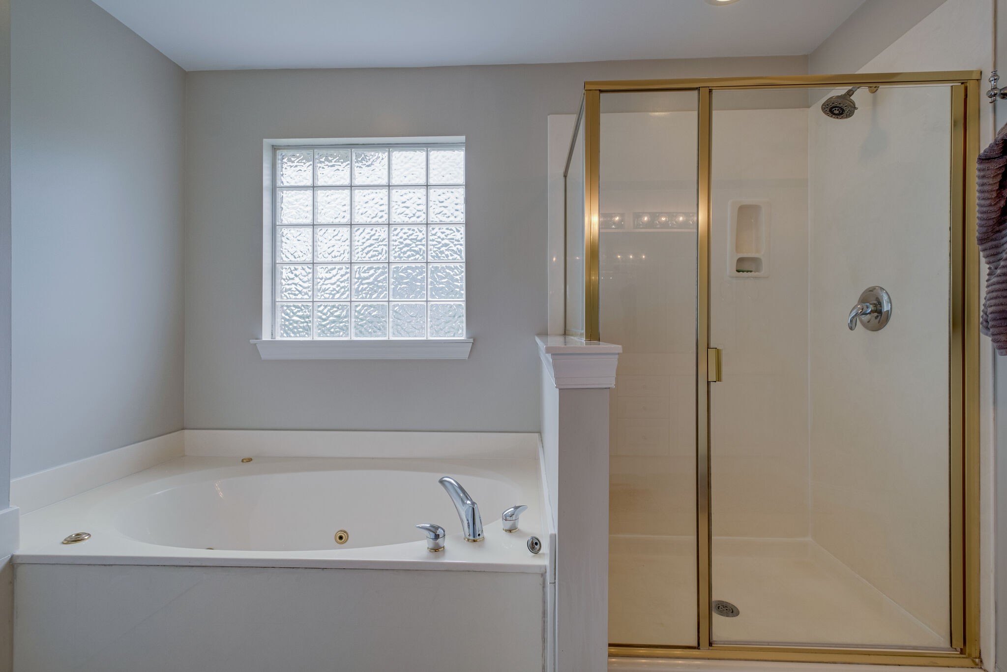 108 Berwick Place Franklin, TN 37064 - Photo 19 of 28 a bathroom with a bathtub and a shower