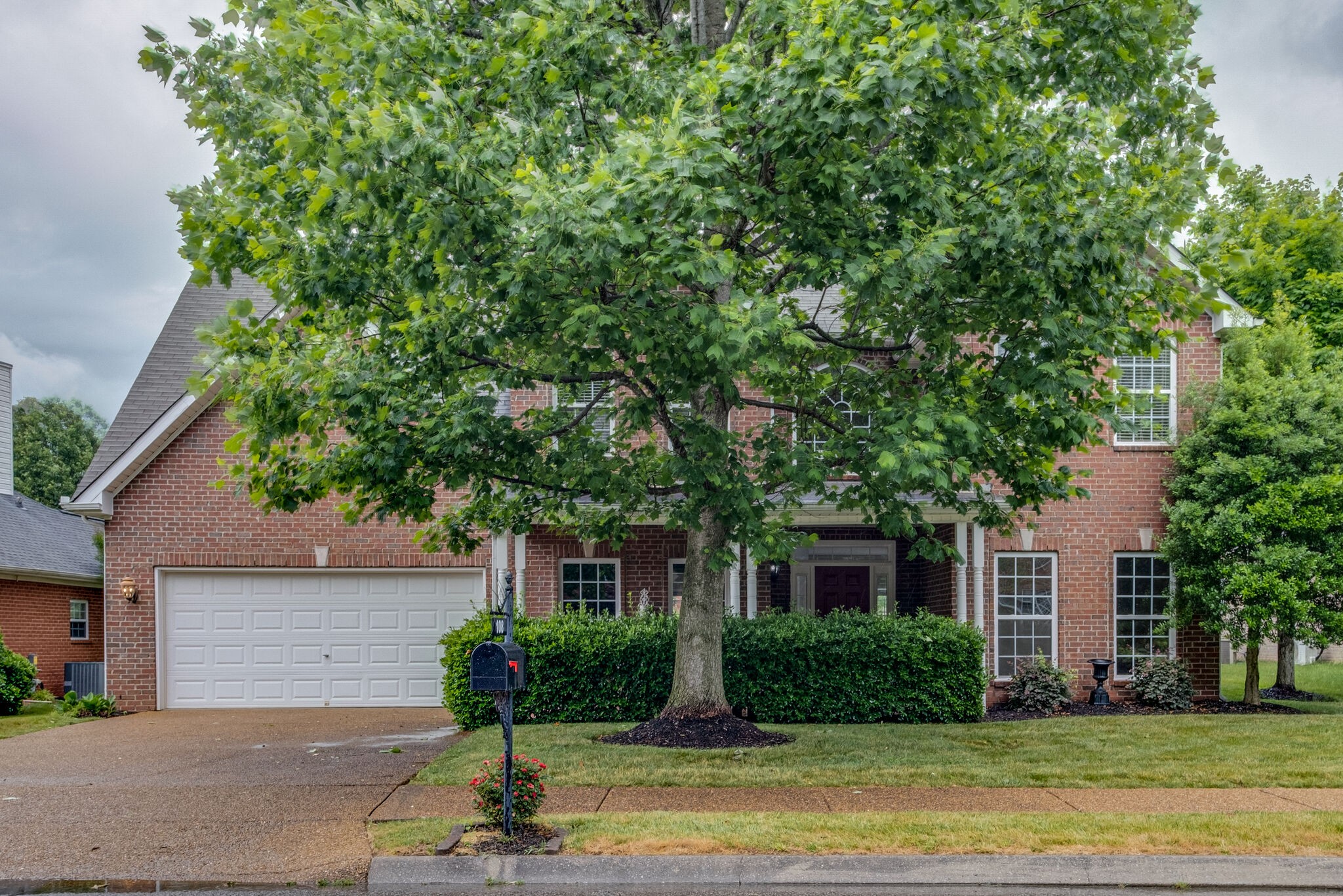 108 Berwick Place Franklin, TN 37064 - Photo 2 of 28 a front view of a house with garden