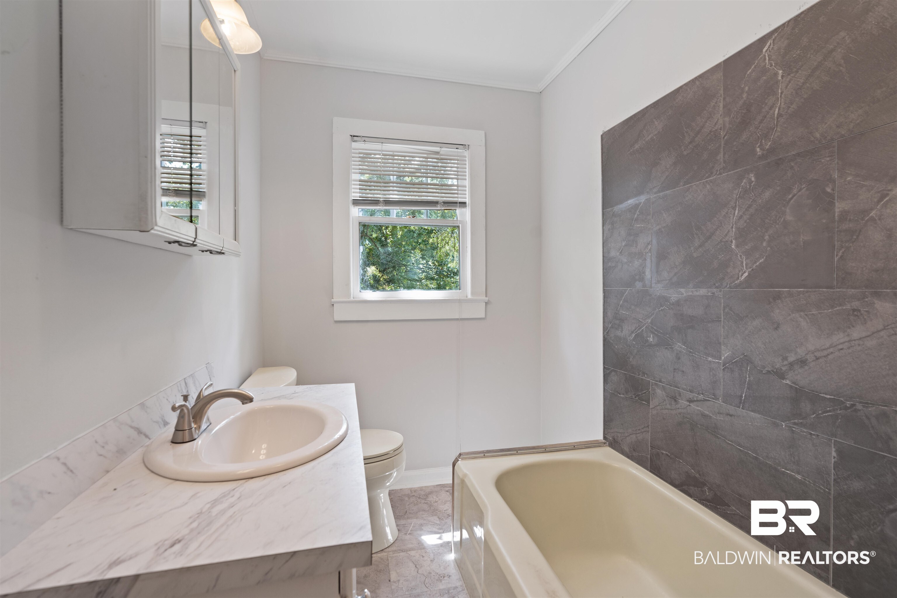 2126 Barron Place Mobile, AL 36605 - Photo 18 of 33 Bathroom with toilet, tile patterned flooring, vanity, ornamental molding, and a washtub