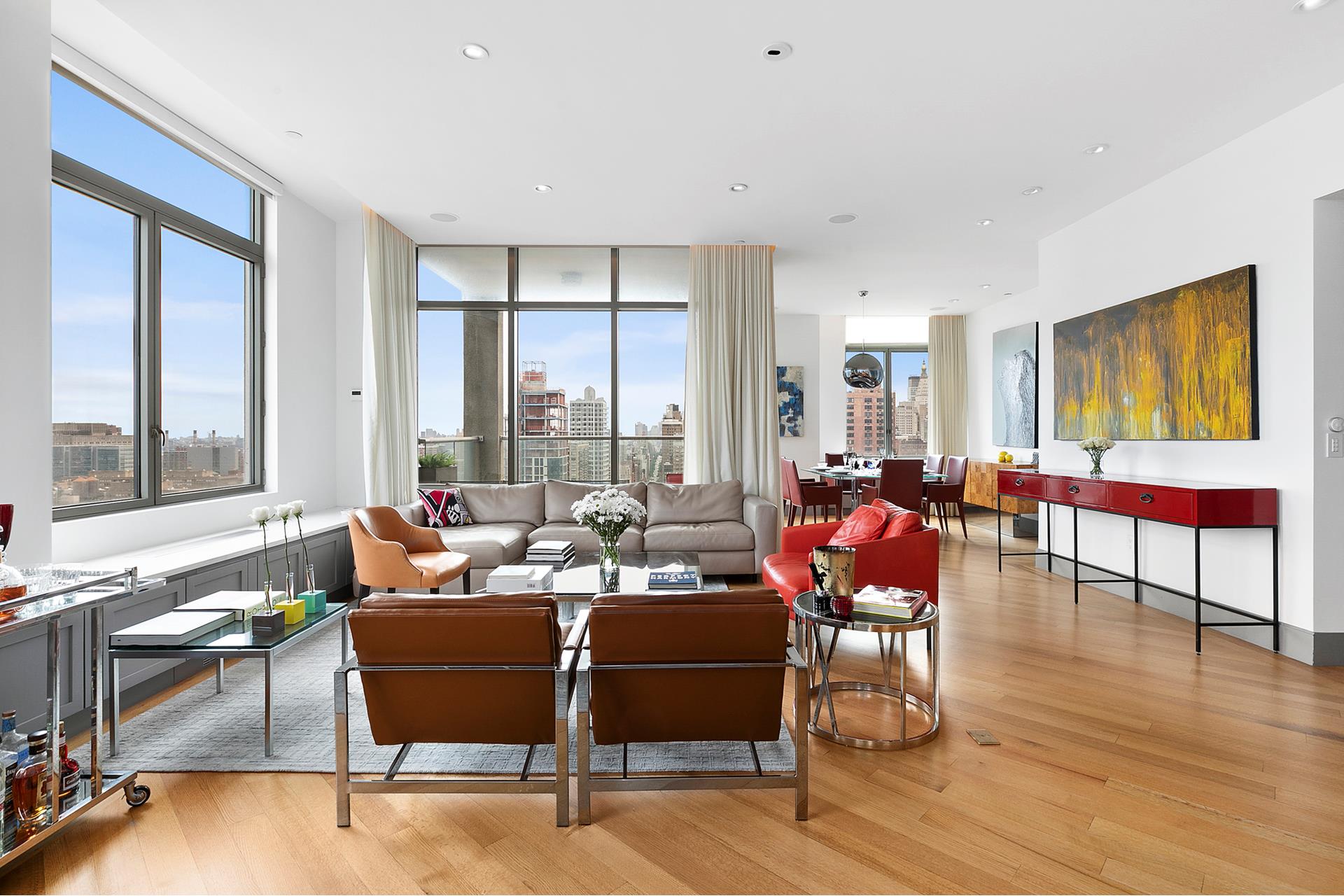 556 3rd Avenue, Unit PHD Manhattan, NY 10016 - Photo 1 of 1 a living room with furniture and floor to ceiling windows
