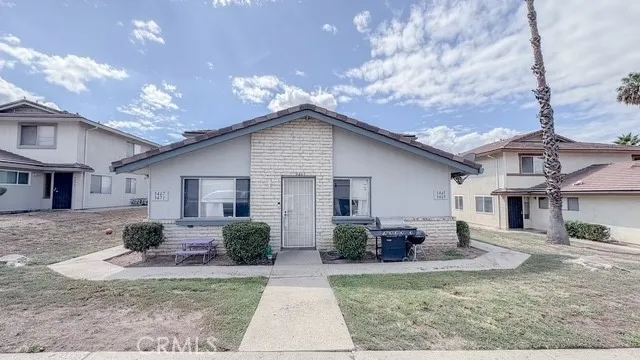 a view of a yard in front view of a house