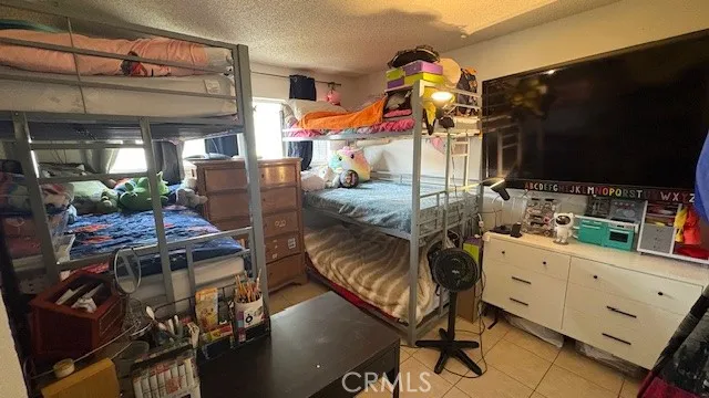 a white toilet sitting next to a small bathroom sink