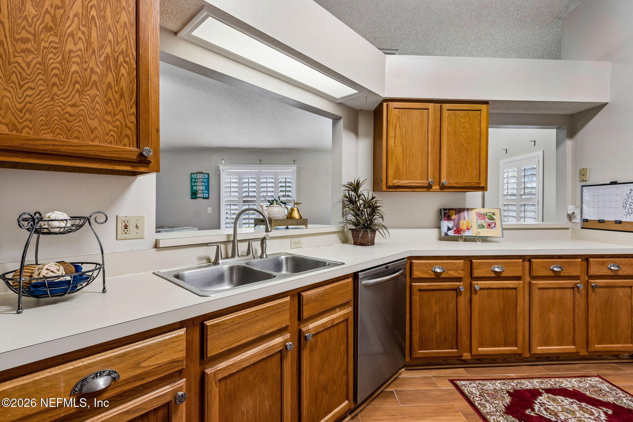 12648 Moose Road Jacksonville, FL 32226 - Photo 14 of 38 a kitchen with sink and cabinets