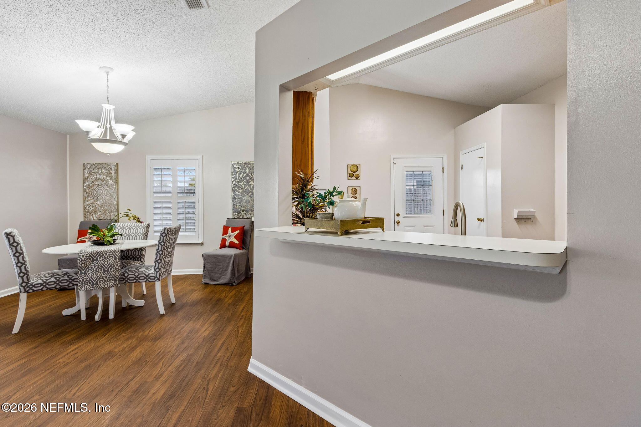 12648 Moose Road Jacksonville, FL 32226 - Photo 15 of 38 a living room with furniture and a wooden floor